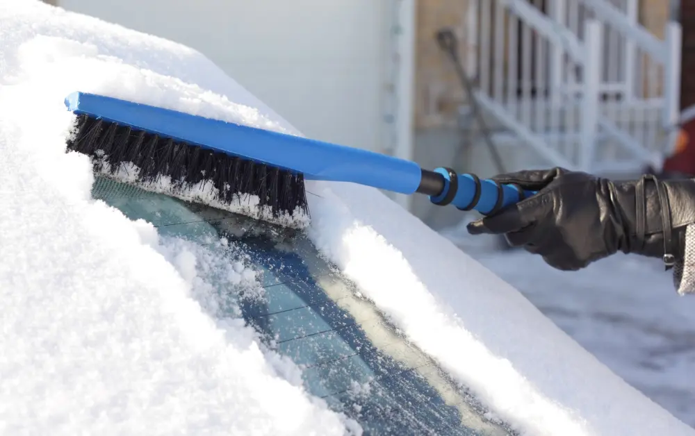 Snow Removing from car